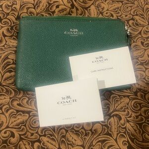 Coach Dark Green Zip wristlet with cc slots inside.